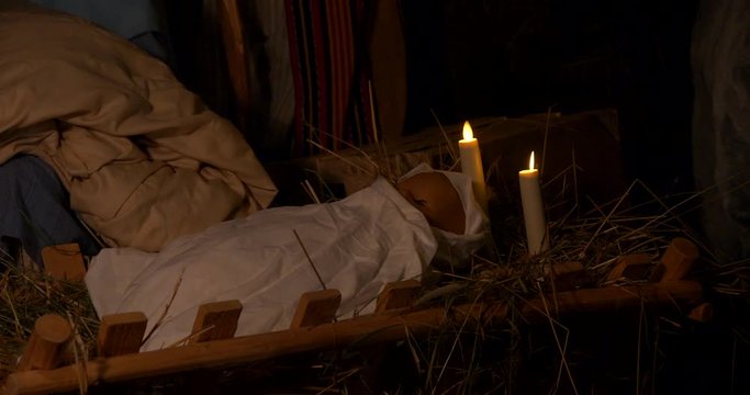 Jesus in manger cradle at night, stable in Bethlehem