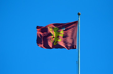 Flag with the Royal Coat of arms of the Norwegian Monarch on the roof of the palace. Oslo,Norway