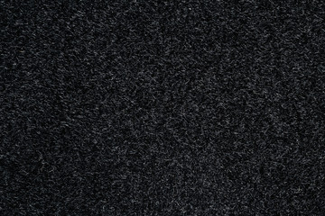 Black canvas or velvet paper texture. Closeup