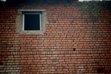 Fototapeta na wymiar brick wall with window