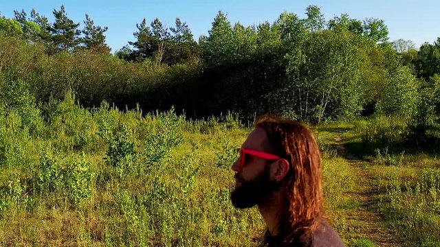 slow motion men with long hair walking
