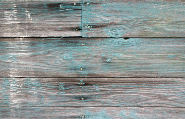 Naklejka premium Old wooden wall with green paint layer, background texture
