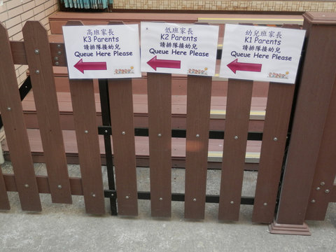 Queuing instructions outside school in Hong Kong fishing village