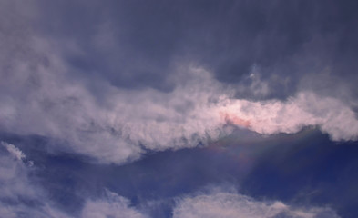 Irisation with clouds in blue sky, Rainbow at the clouds