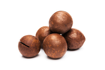 Shelled  macadamia nuts on white background