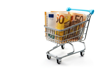 Grocery cart with euro bills isolated on white. shopping, loan, money saving, pension, investments concept