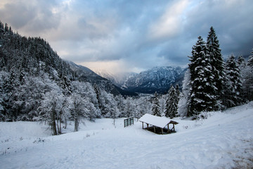 Fototapeta na wymiar Beautiful Winter View of Hallstatt Austria with dramatic sky and clouds