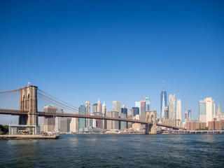 Fototapeta na wymiar Brooklyn bridge, New York, USA - September 2019: [ Brooklyn bridge architecture with panoramic view of New York City and lower Manhattan, One World Trade Center, Dumbo ]