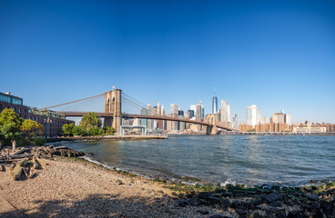 Brooklyn bridge, New York, USA - September 2019: [ Brooklyn bridge architecture with panoramic view of New York City and lower Manhattan, One World Trade Center, Dumbo ]