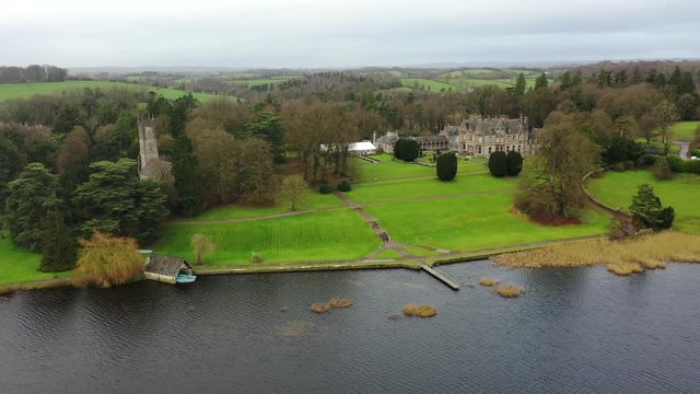 Castle Leslie, Glaslough, Monaghan, Ireland, Drone flying high revealing lake and estate