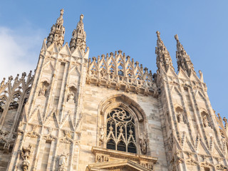 Fototapeta premium Milano, Italy. The main facade of the Dome, famous Cathedral in Milan. Duomo in Italian. The church is a main landmark of the town