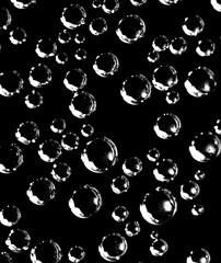 Air balls in water on a black background
