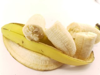 ripe yellow bananas on a white background