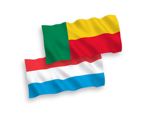 Flags of Benin and Luxembourg on a white background