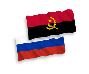 Flags of Angola and Russia on a white background