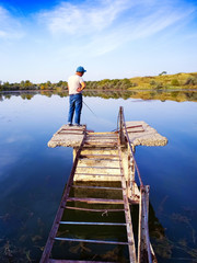 Naklejka premium man on fishing, beautiful surrounding nature