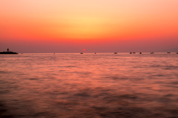 sunset at sea and fishers