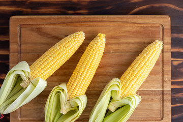 Corn cobs on a wooden table