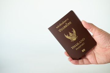 Man hand holding Thailand Passports