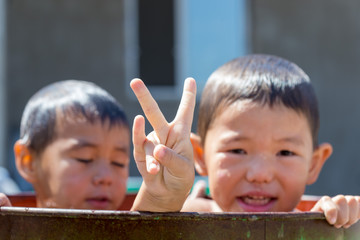 children bathe in the courtyard of the house