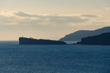Fototapeta premium Natural landscape with the silhouette of the Cape Tomisina
