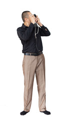 Photo of a young man in classic clothes with a retro camera, isolated on white background