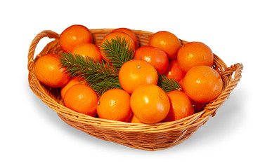 Tangerines with cinnamon in a basket isolated with shadow