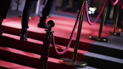 Feet of guests climbing the red carpet, anonymous vip persons