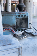 Close up of the motor area of an old farm tractor