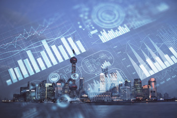 Forex chart on cityscape with tall buildings background multi exposure. Financial research concept.