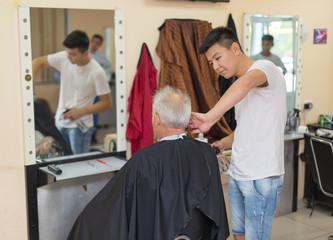 Hairdresser, master works with clients