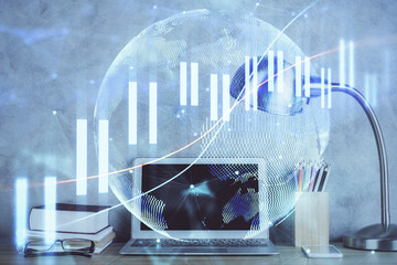 Multi exposure of chart and financial info and work space with computer background. Concept of...