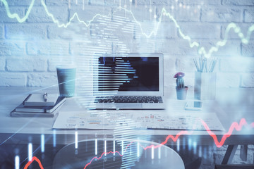 Stock market graph on background with desk and personal computer. Multi exposure. Concept of financial analysis.