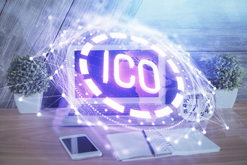 Double exposure of blockchain theme hologram and table with computer background. Concept of bitcoin crypto currency.