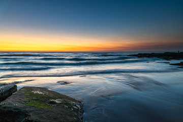 Fototapeta na wymiar Sunrise Seascape with Soft Cloud on the Horizon