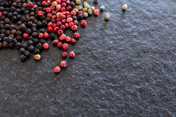 red pepper on black stone, gourmet spices and background for traditional Ionian or spicy cuisine. Background for kitchen and for pepper
