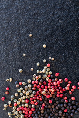 red pepper on black stone, gourmet spices and background for traditional Ionian or spicy cuisine. Background for kitchen and for pepper