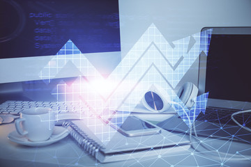 Computer on desktop with point up arrows hologram. Double exposure. Concept of success.