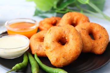 Vada or Medu vadai with sambar and coconut chutney - Popular South Indian snack. recipe ingredients with Copy space