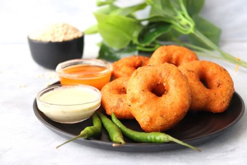 Vada or Medu vadai with sambar and coconut chutney - Popular South Indian snack. recipe ingredients with Copy space