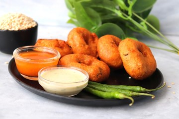 Vada or Medu vadai with sambar and coconut chutney - Popular South Indian snack. recipe ingredients with Copy space