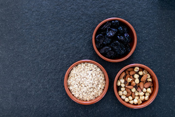 Healty, vegetarian dried fruit breakfast. Set of bowls with dried fruit to enrich a healthy vegan...