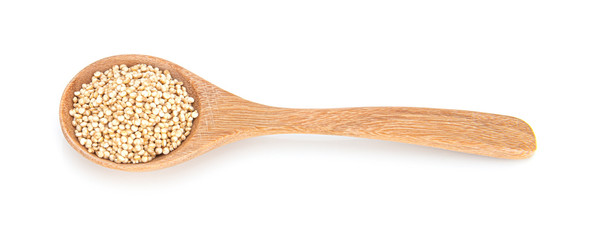 quinoa seeds in wooden spoon isolated on white background