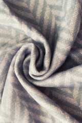 Crumpled cashmere.Autumn background. Beautiful elegant pink scarf. Flat position, top view
