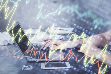 Double exposure of forex chart with man working on computer on background. Concept of market analysis.