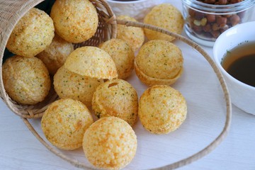 Panipuri or Golgappa. Indian street snack made of fried mint flavors puries, mint chutney, sprouts and dates, tamarind chutney. Indian Chat.