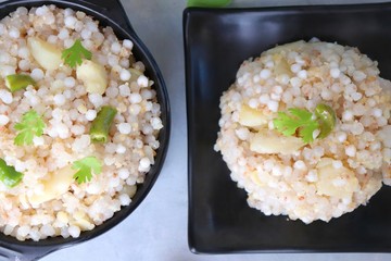 Indian Food dish made out of Sago called Sabudana khichdi, Usually eaten during fasting days. Recipe Ingredients along with copy space