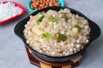 Indian Food dish made out of Sago called Sabudana khichdi, Usually eaten during fasting days. Recipe Ingredients along with copy space