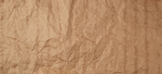 crumpled brown kraft paper texture with bold spots, full frame