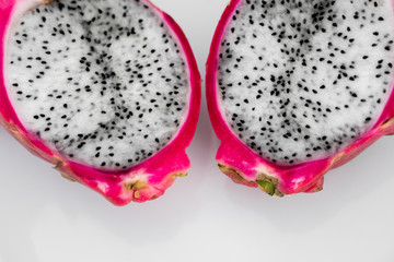 Dragon fruit. Vibrant Dragon Fruit on white background. Sliced white dragon fruit or pitaya on...